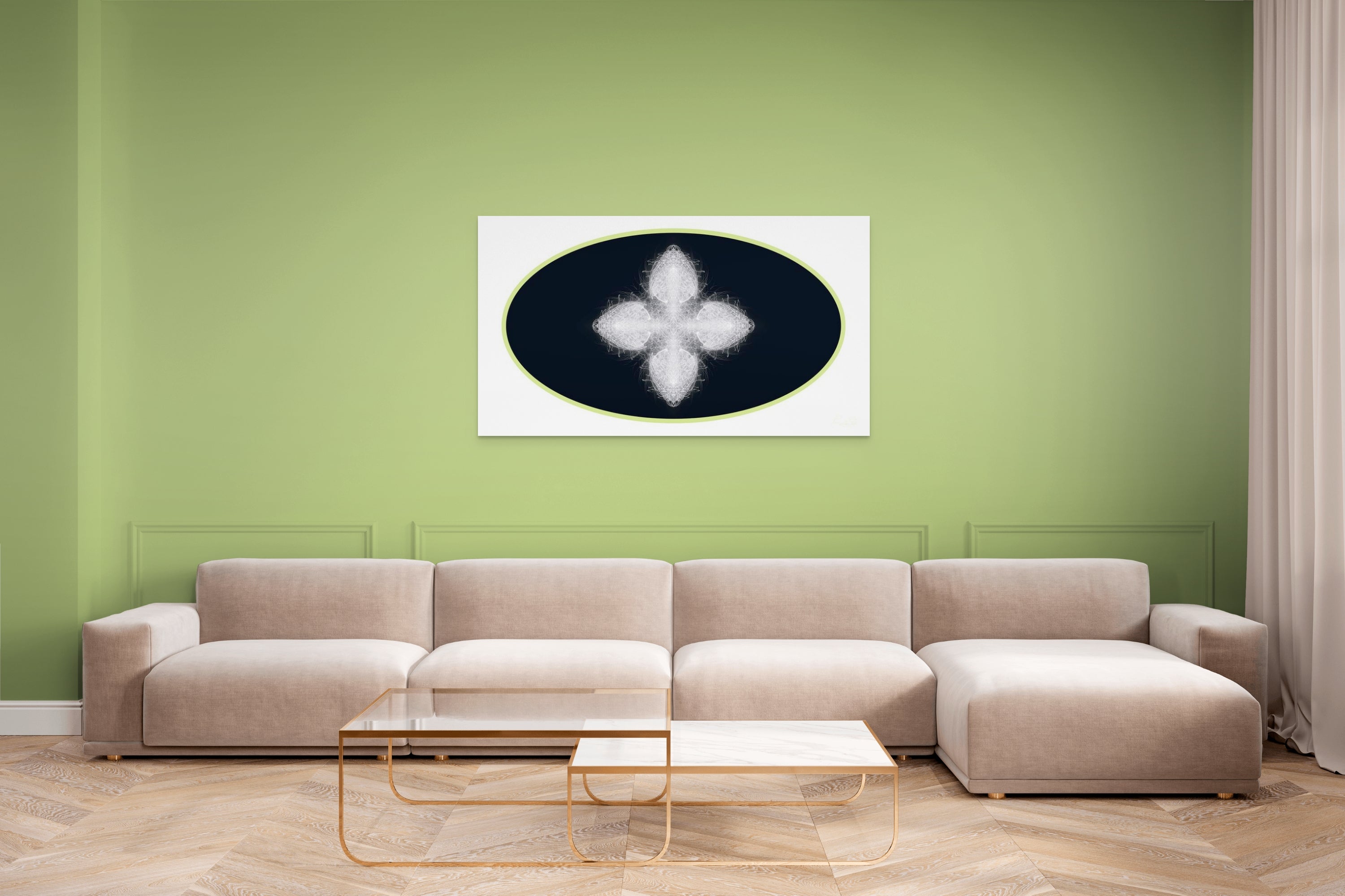 Beige sectional sofa in a living room with a green wall and geometric white, black and green artwork on wall.