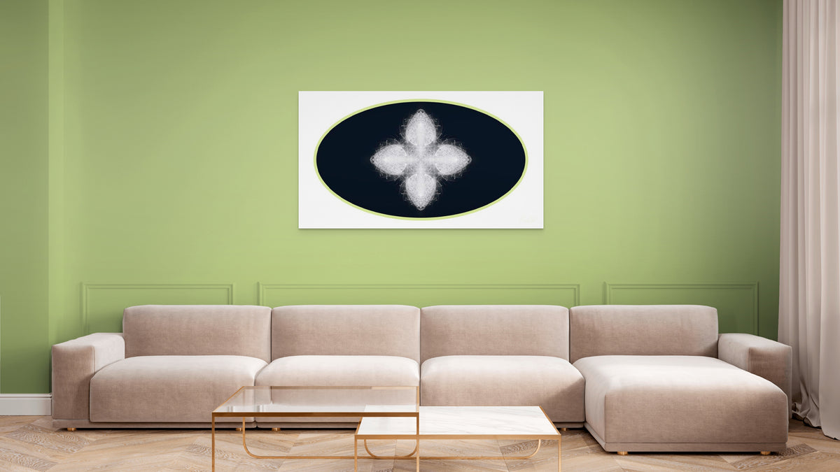 Beige sectional sofa in a living room with a green wall and geometric white, black and green artwork on wall.