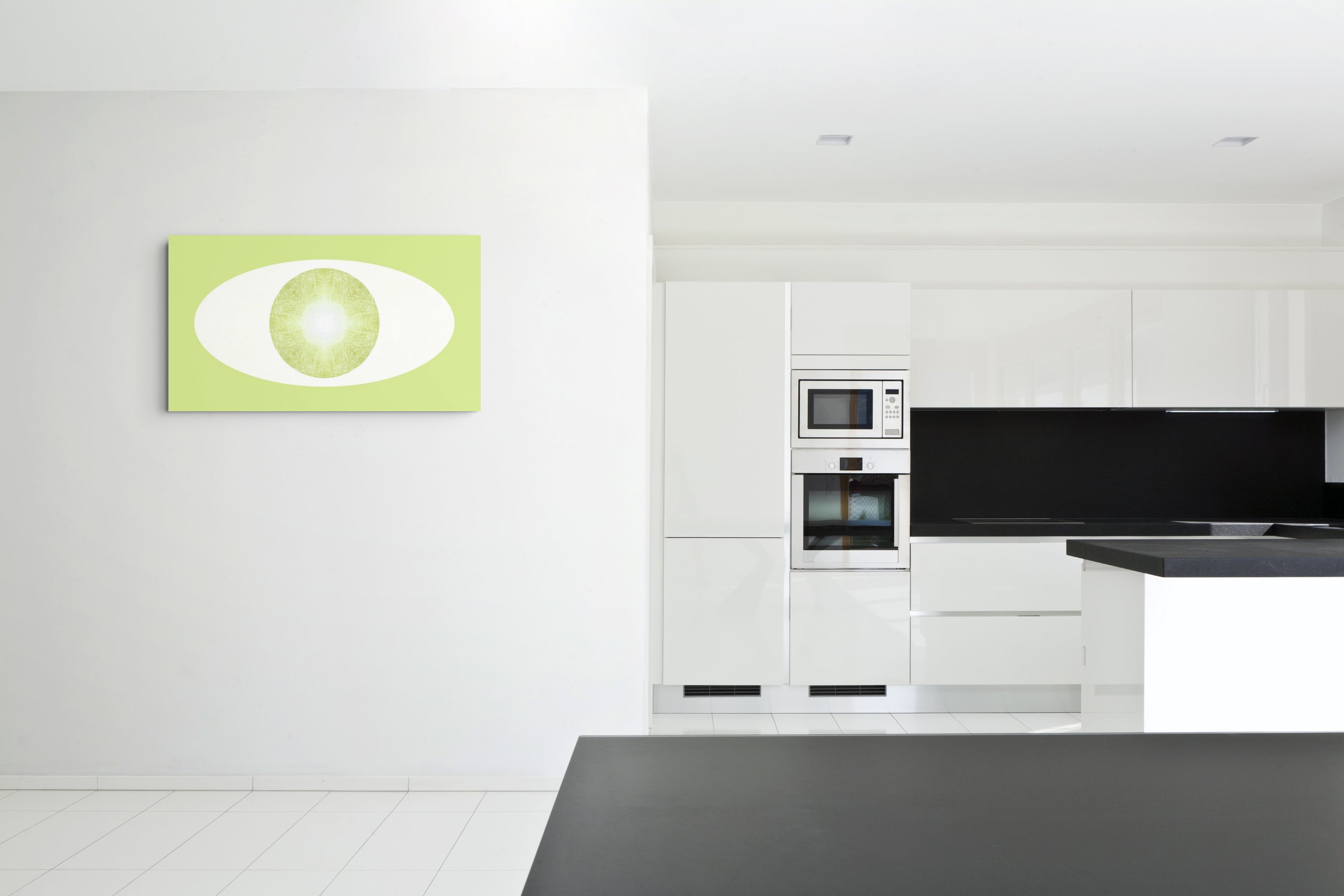 Modern kitchen with white cabinets, black  countertop and backsplash, and a green and white abstract artwork on the wall.